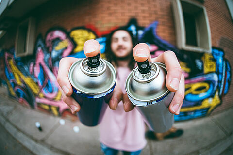Graffiti artist with dreadlocks
